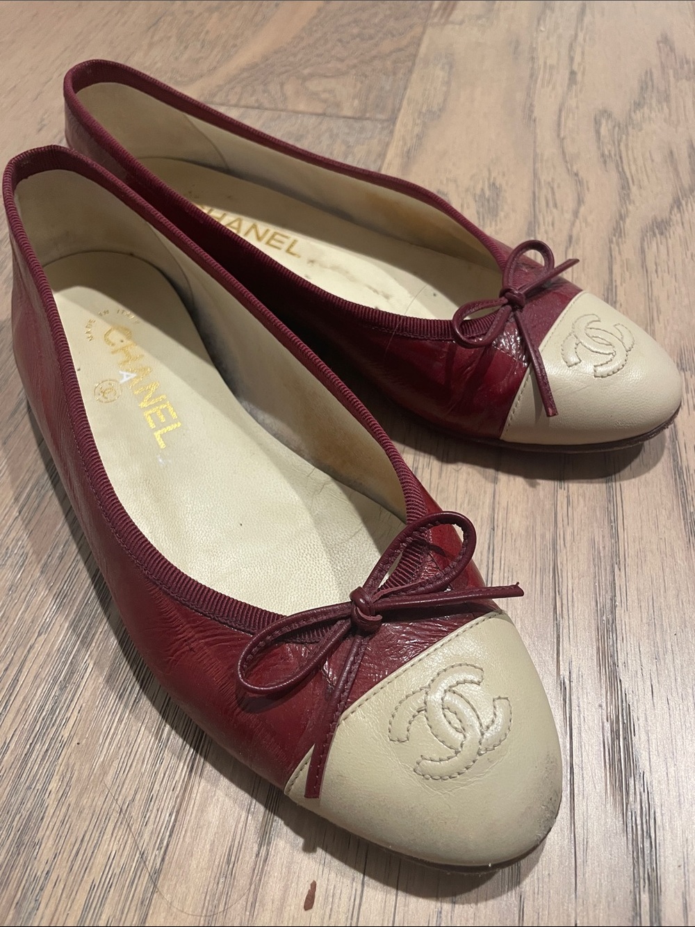 CHANEL Burgundy Eel Skin and Cream Cap-Toe Ballet Flats